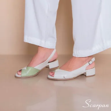 A sandália feminina de couro da Scarpan reúne características exclusivas que garantem conforto e segurança: Couro super macio: Confeccionada com couro de alta qualidade, proporciona um toque suave e acomoda os pés com delicadeza, mesmo em caso de joanetes. Forração em tecido dublado com espuma: Reduz atritos e aumenta o conforto durante todo o dia. Palmilha em EVA de 4 mm: Oferece amortecimento superior, aliviando a pressão nos pés e garantindo mais conforto ao caminhar. Solado em TR antiderrapante: Além disso, proporciona estabilidade e segurança em diferentes tipos de piso. Salto baixo de 3,5 cm: Altura ideal recomendada por ortopedistas para melhorar a circulação, reduzir o impacto nas articulações e oferecer mais equilíbrio. Cabedal anatômico: Projetado para acomodar os pés confortavelmente, sem apertar, mesmo para quem possui joanetes.