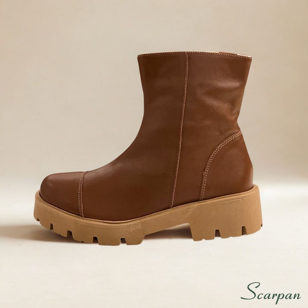 1e4c5ceafde60dd4f5557468de2f880b.jpg esse coturno em couro entrega um conforto pensado nos mínimos detalhes. O forro têxtil dublado com espuma proporciona uma experiência acolhedora ao calçar. Não importa se o dia será longo ou repleto de imprevistos: seus pés estarão bem cuidados e protegidos. O salto de 4,5 cm oferece a elevação ideal, promovendo uma pisada firme e confortável, enquanto a parte frontal do solado com 2,5 cm garante estabilidade. Além disso, o solado de PVC expandido e emborrachado proporciona aderência superior e segurança em diferentes tipos de solo, bem como, a correria do dia a dia.