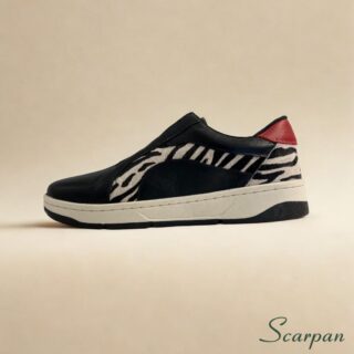 Tênis Feminino de Couro com Elástico nas cores preto e detalhe em zebra e vermelho