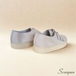 Visão traseira de tênis casual feminino em couro legítimo Off White