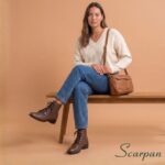 Look elegante de trabalho com calça de jeans e blusa off White e a bota de couro Whisky Serena